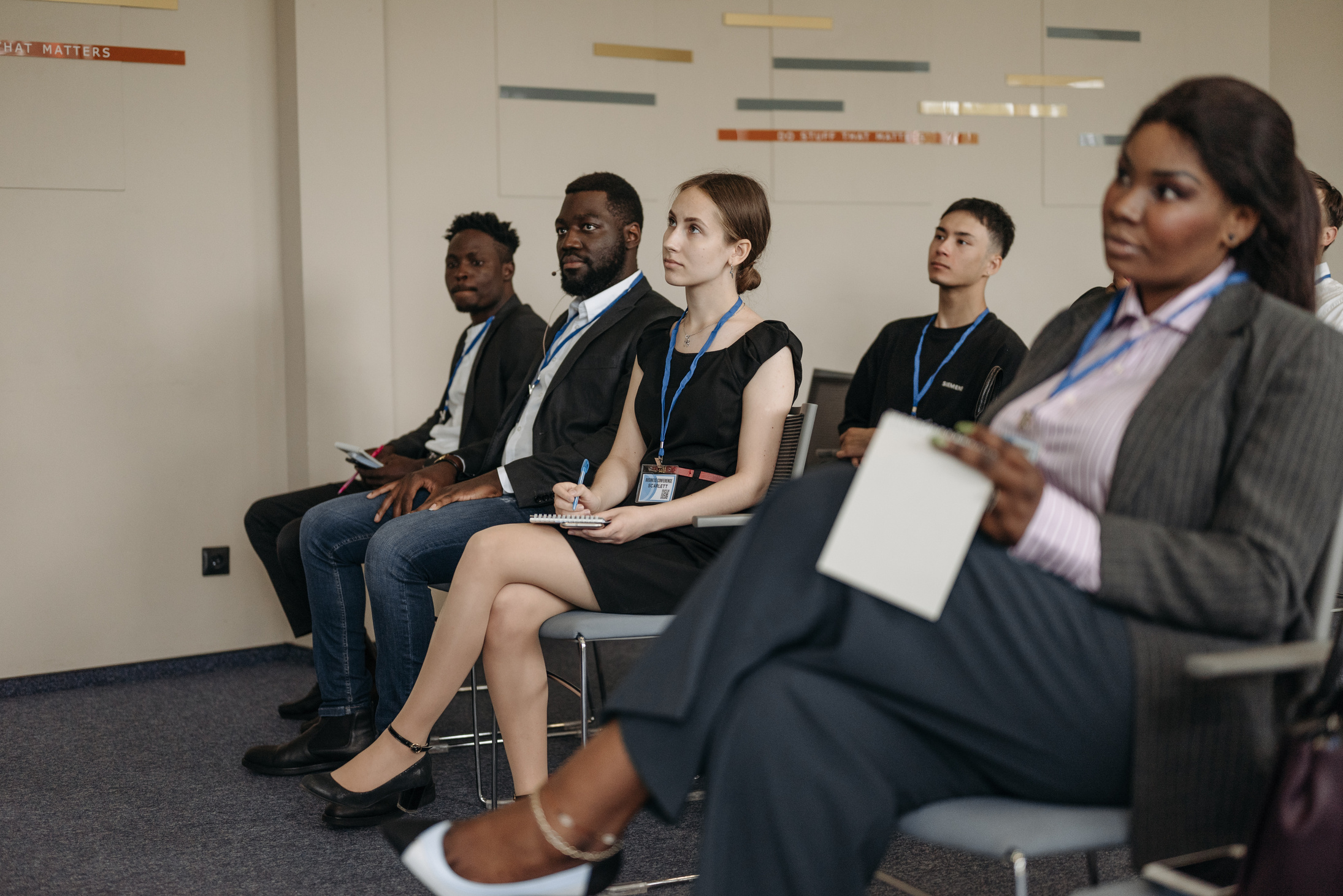 People Sitting on Black Chairs